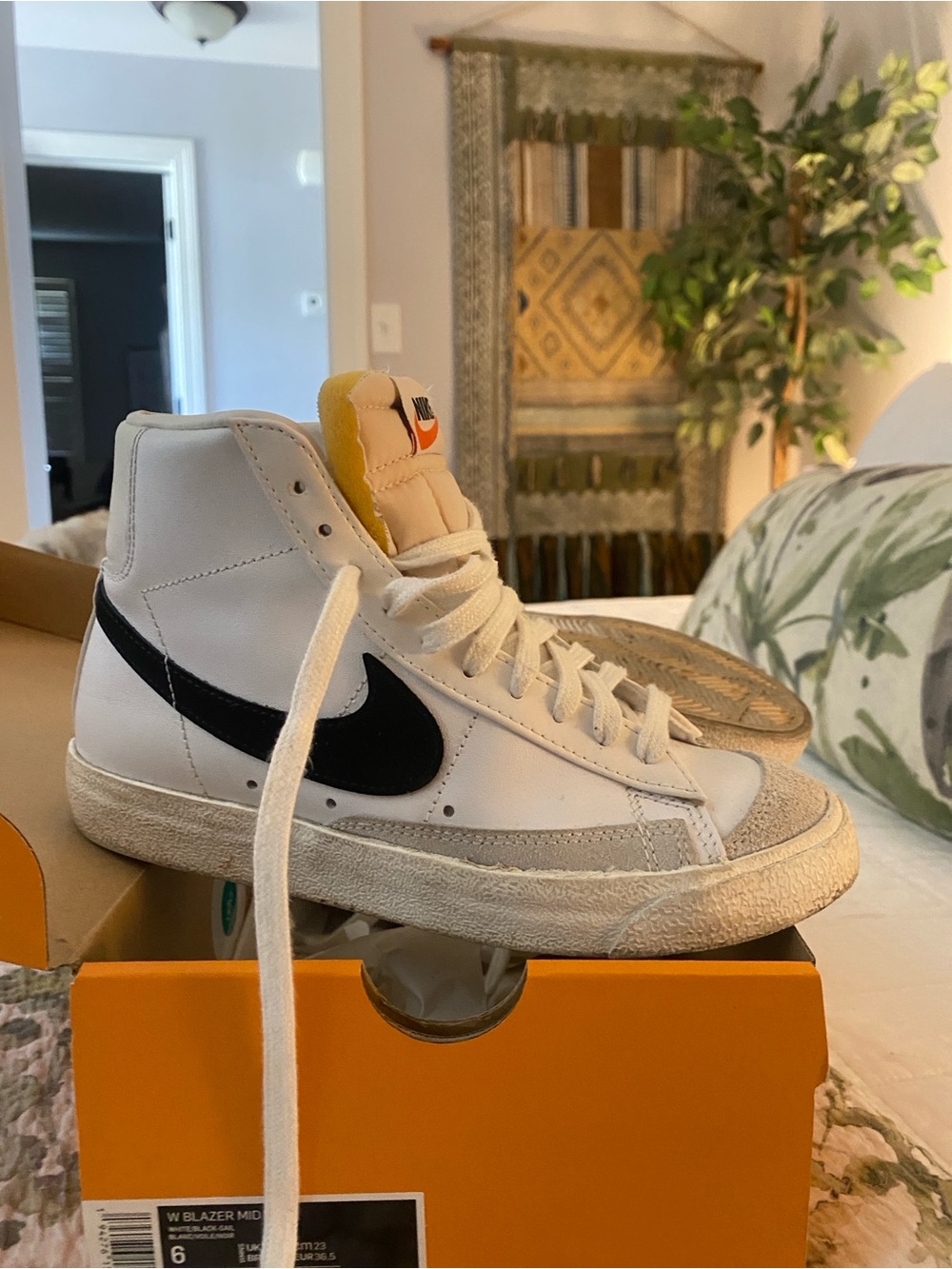 Nike White High-Top Sneakers with Black Swoosh